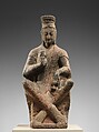 Bodhisattva (Maitreya) with crossed ankles, Sandstone with traces of pigment, China